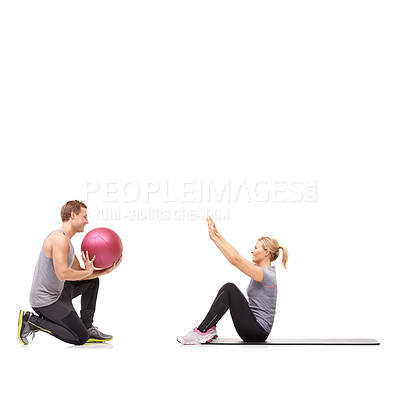 Buy stock photo Coaching, man and woman with gym ball for fitness in studio, body wellness and support. Sports workout, girl and personal trainer with sphere for balance, mat training and power on white background.