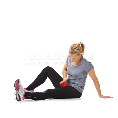 Buy stock photo Woman, massage ball and healing injury in studio, care and health or wellness by white background. Female person, athlete and physical therapy or rehabilitation for muscles in legs and body in mockup