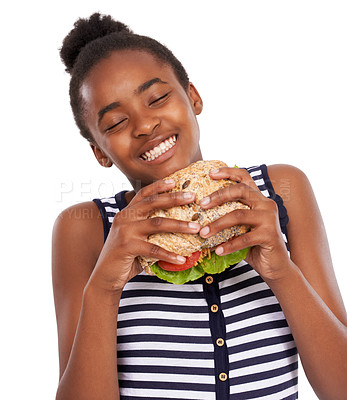 Buy stock photo Shot of a happy young african american girl holding a salad sandwich isolated on white