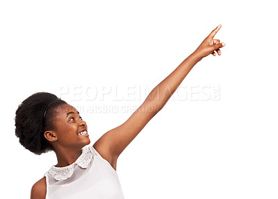 Buy stock photo Smile, pointing and portrait of black girl in studio with mockup space for marketing or advertising. Happy, sale and gen z African child with positive face expression isolated by white background.