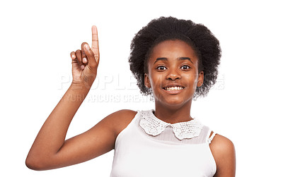 Buy stock photo Smile, pointing and portrait of black girl in studio with mockup space for marketing or advertising. Happy, sale and young African child with positive face expression isolated by white background.