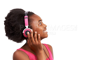 Buy stock photo Headphones, happy and young black girl in a studio listening to music, album or playlist. Smile, teenager and gen z African child model streaming a podcast, song or radio by white background.