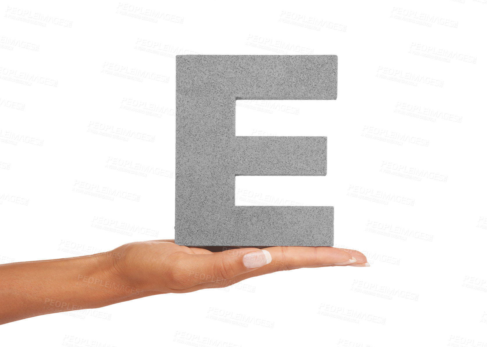 Buy stock photo Hand of woman, capital letter E and presentation of vowel isolated on white background. Character, font and palm showing English alphabet typeface for communication, reading and writing in studio.