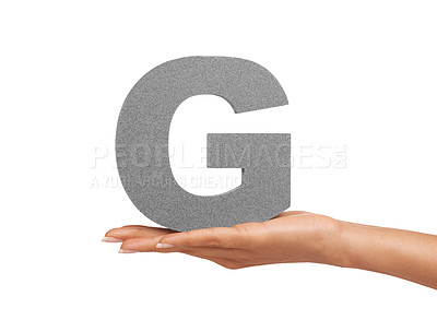 Buy stock photo Hand, capital letter G and presentation of font consonant isolated on white background. Character, palm and woman showing English alphabet typeface for communication, reading and writing in studio.