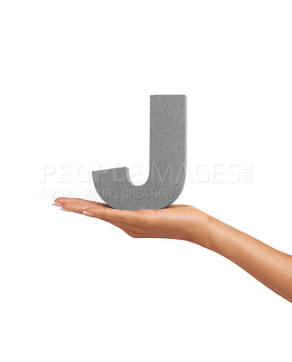 Buy stock photo Hand of woman, font letter J and presentation of consonant isolated on white background. Character, uppercase and palm with English alphabet typeface for communication, reading and writing in studio.
