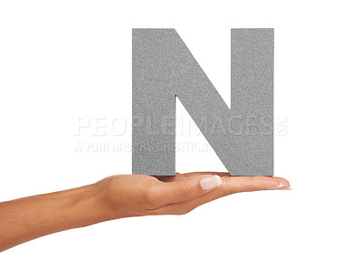 Buy stock photo Woman, hand and letter N or alphabet in studio for advertising, learning or teaching presentation. Sign, font or character for abc, text and communication or grammar and symbol on white background