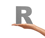 The letter "R" in her palm