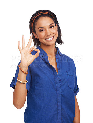 Buy stock photo A pretty african-american woman giving you the a-okay sign while isolated on white