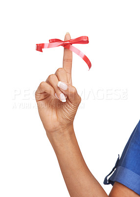 Buy stock photo Finger, ribbon and red bow on for reminder of event, commitment or sign remember task in studio. Attention, symbol and  icon on hand to notice date of appointment or helping to alert memory of person