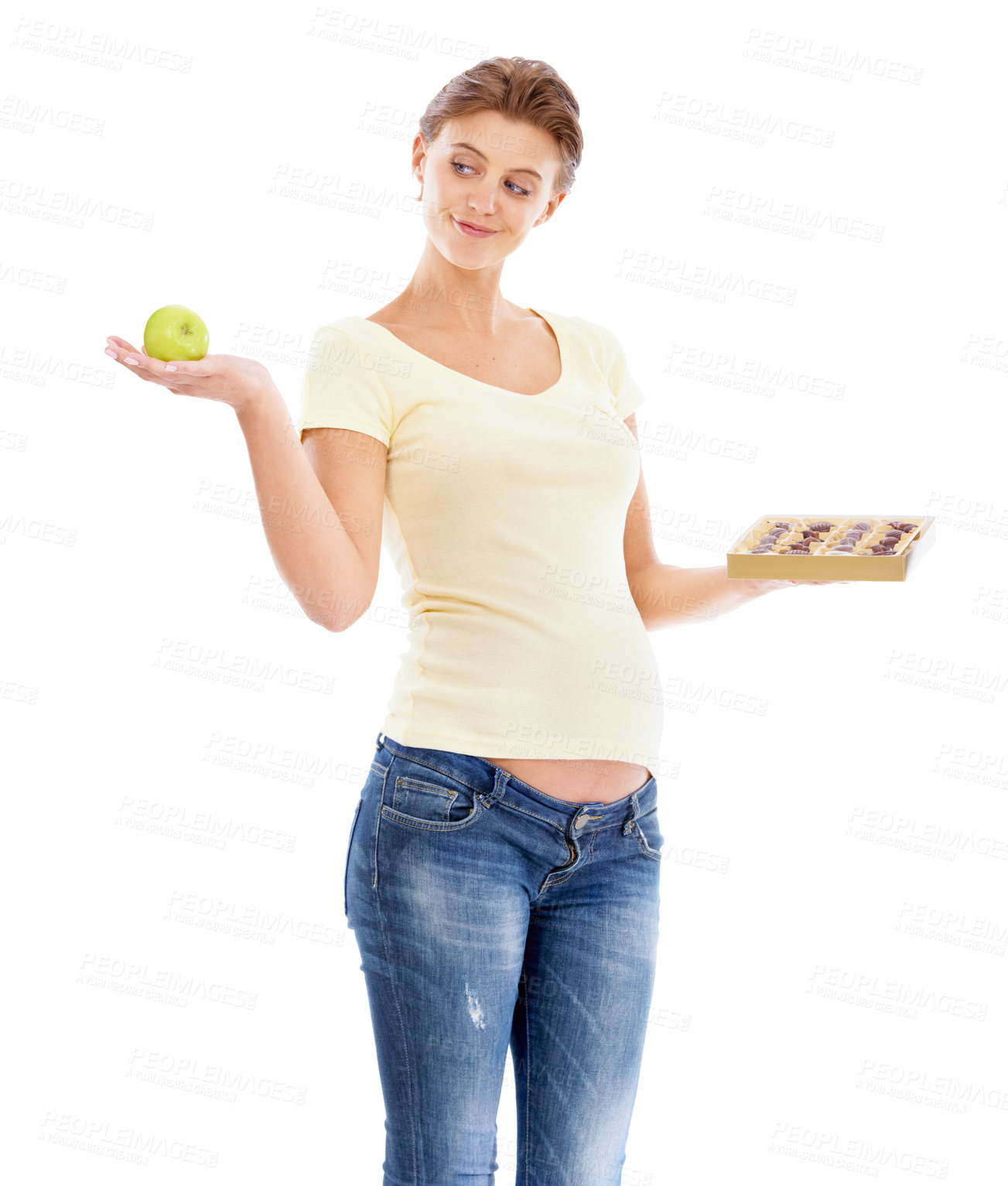Buy stock photo Woman, pregnant and studio with choice, apple or chocolate for nutrition, health and wellness. Pregnant woman, healthy fruit or candy with decision for diet, healthcare and isolated white background
