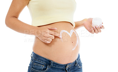 Buy stock photo Pregnant woman, abdomen and cream with heart, white background and body cosmetics. Skincare, pregnancy stomach and lotion for stretch marks, aesthetic wellness and healthy maternity for studio beauty