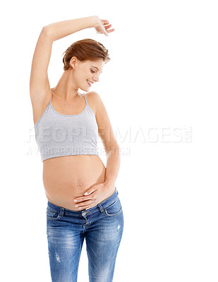 Buy stock photo Body of happy pregnant woman in studio dance on white background for pregnancy health, growth and development. Healthcare, wellness and an excited mother, hand holding stomach with advertising space