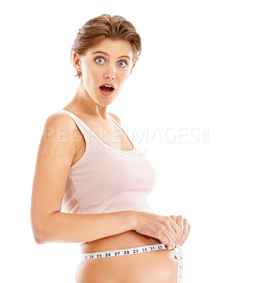 Buy stock photo Portrait, surprise and shocked pregnant woman with measuring tape on stomach, on white background. Health, wellness and pregnancy, surprised woman measuring growth progress of baby in belly in studio