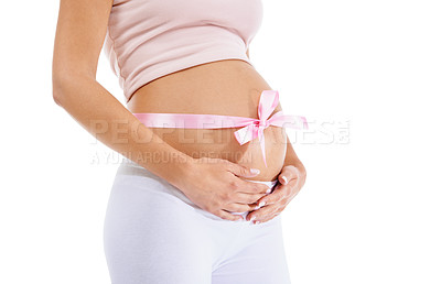 Buy stock photo Pregnant woman, pink ribbon and stomach on studio background of maternity health and wellness. Belly, pregnancy and bow of baby shower, girl announcement and gift of life, fertility and future mother