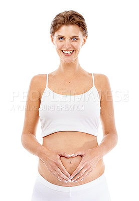 Buy stock photo Pregnancy, portrait and mom with a heart on her stomach in a studio for prenatal care, love and happiness. Wellness, health and happy pregnant female model holding her tummy by a white background.