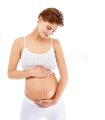 Buy stock photo Pregnancy, love and woman holding her stomach in a studio for prenatal care, motherhood and happiness. Maternity, health and happy pregnant female model embracing her tummy by a white background.