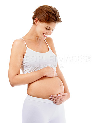 Buy stock photo Pregnancy love, smile and happy woman with stomach on a white background in studio. Happiness, care and pregnant woman smiling at her pregnant abdomen on a studio background with mockup space