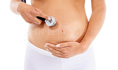 Buy stock photo Healthcare, pregnancy and stomach of a woman with a stethoscope on a white background in studio. Baby, abdomen and pregnant woman listening for health of heartbeat of a child on a studio background