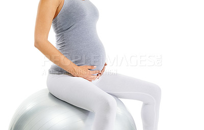 Buy stock photo Pregnant woman, stomach and exercise ball with white background for fitness, pilates and wellness. Pregnancy, medicine ball and workout in studio for healthy maternity, yoga training and body energy