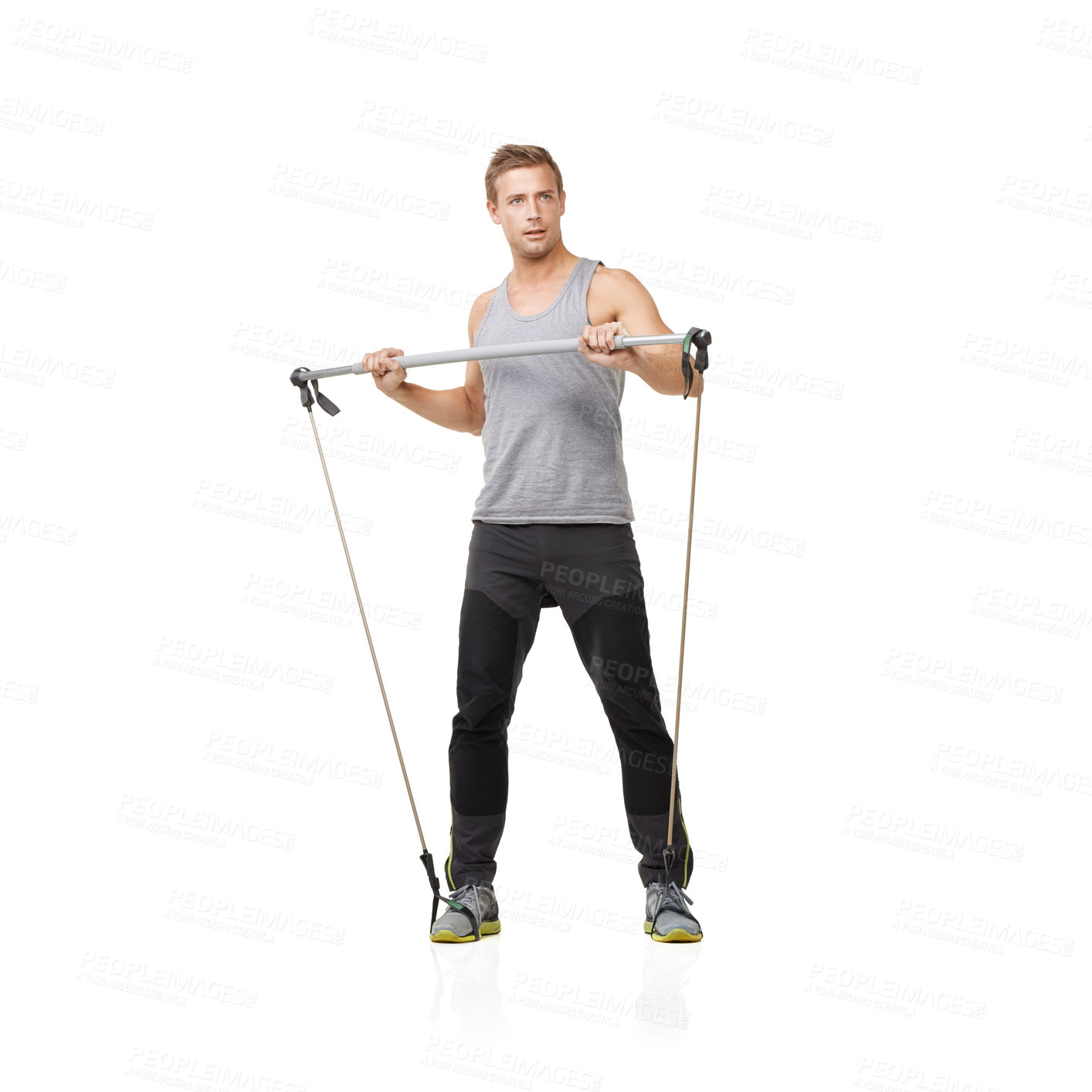 Buy stock photo Gym, fitness and resistance band with a strong man in studio isolated on a white background for health. Idea, exercise or performance and a young athlete training with equipment for wellness
