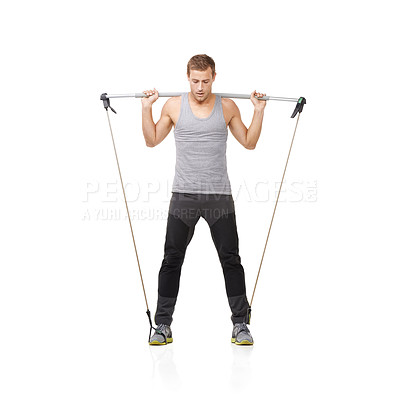 Buy stock photo Gym, workout and resistance band with a young man in studio isolated on a white background for health. Fitness, exercise or performance and a strong athlete training with equipment for wellness
