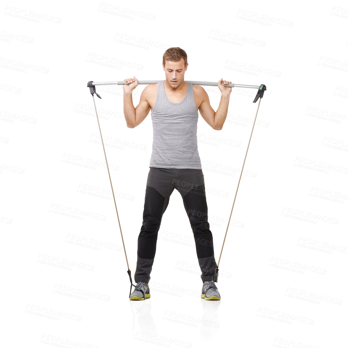Buy stock photo Gym, workout and resistance band with a young man in studio isolated on a white background for health. Fitness, exercise or performance and a strong athlete training with equipment for wellness