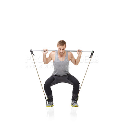 Buy stock photo Fitness, exercise and resistance band with a young man in studio isolated on a white background for health. Gym, workout or performance and a strong athlete training with equipment for wellness