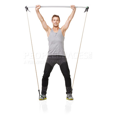 Buy stock photo A young man working his upper body with a resistance band