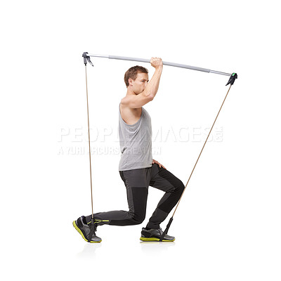 Buy stock photo Fitness, workout and resistance band with a young man in studio isolated on a white background for health. Gym, exercise or performance and a strong athlete training with equipment for wellness