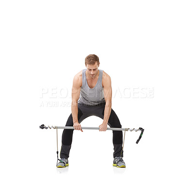 Buy stock photo Exercise, gym and resistance band with a strong man in studio isolated on a white background for health. Fitness, workout or performance and a young athlete training with equipment for wellness