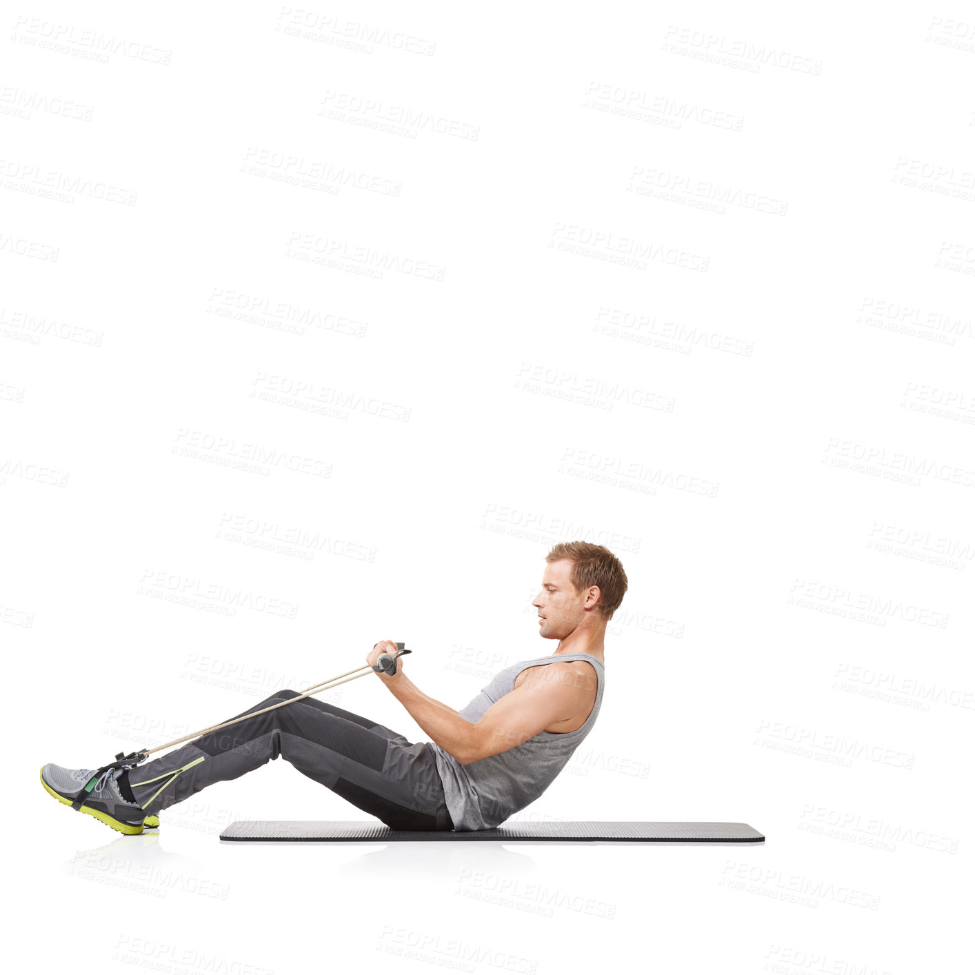 Buy stock photo A young man doing some resistance training