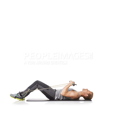 Buy stock photo Exercise, man and resistance band with fitness, workout or wellness isolated on white studio background. Mockup space, person or model with core training, healthy or progress with energy or endurance