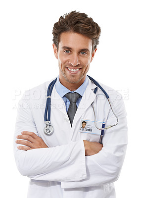 Buy stock photo Studio portrait of a handsome young doctor standing  with his arms crossed and smiling at the camera isolated on white