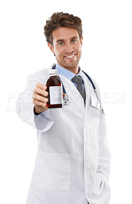 Buy stock photo Studio shot of a positive-looking young doctor holding bottle up to the camera