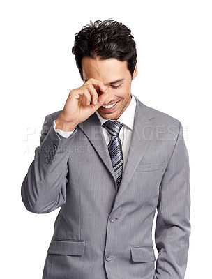 Buy stock photo A handsome young executive laughing to himself while isolated on a white background