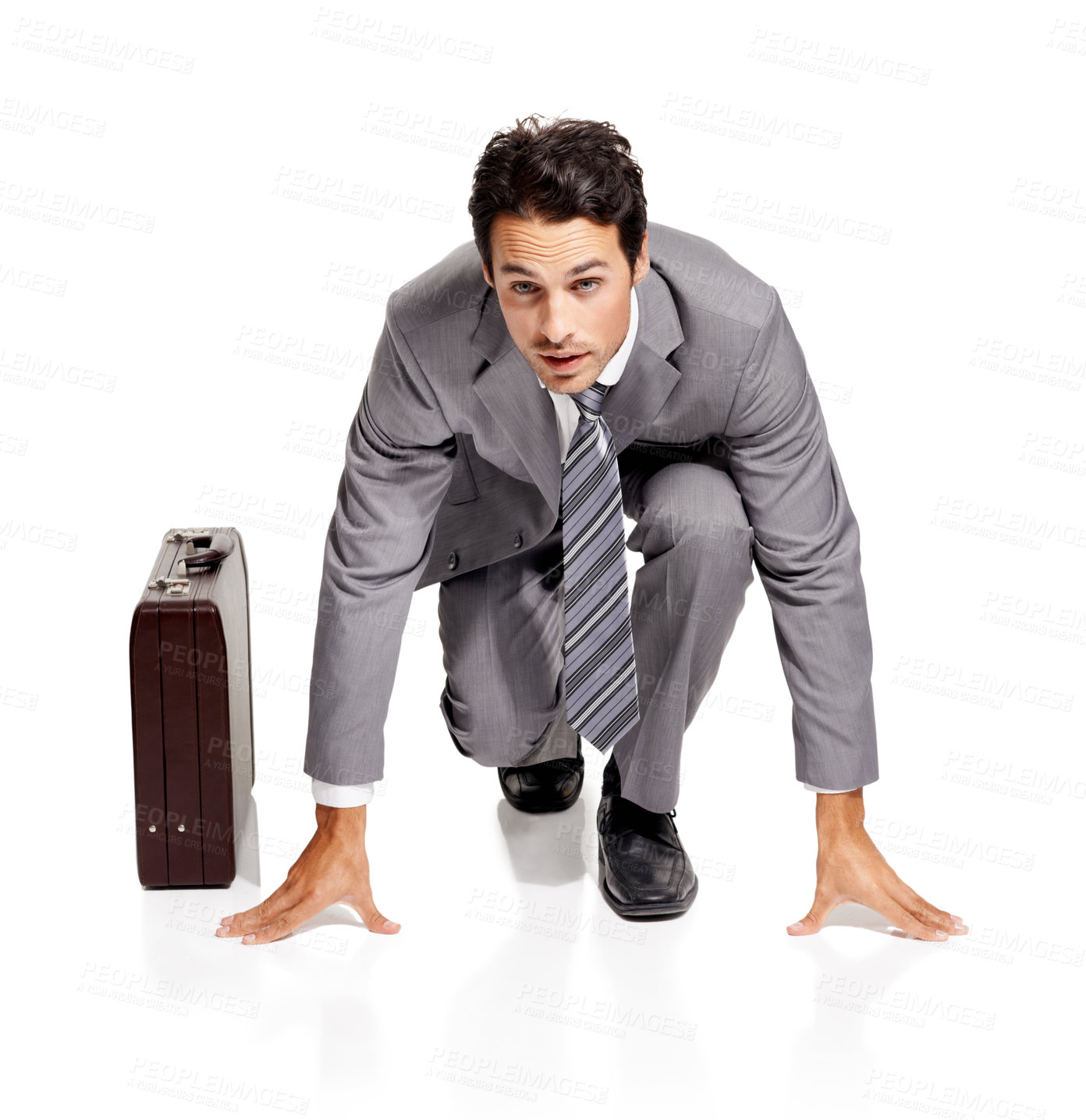 Buy stock photo Ready, run and portrait of businessman with briefcase in studio kneeling, confident or prepared on white background. Corporate, rat race and face of male entrepreneur with time management efficiency