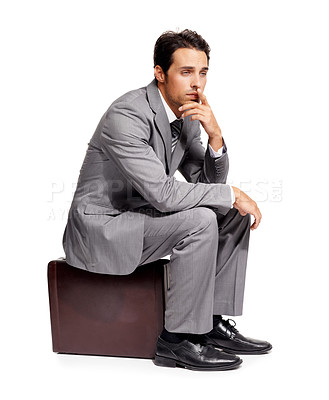 Buy stock photo Stress, thinking and business man with briefcase in studio for travel, fail or mistake on white background. Doubt, anxiety and person sitting on a bag with headache, disaster or compliance problem