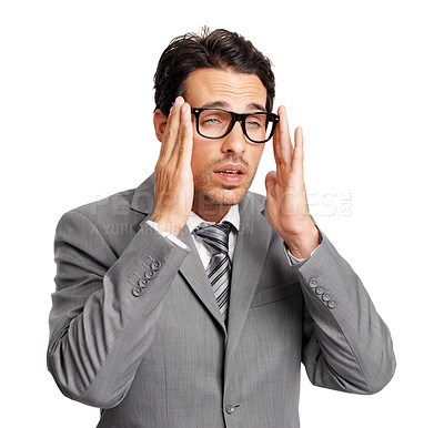 Buy stock photo A bleary-eyed young executive putting his glasses on while isolated on a white background