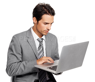 Buy stock photo Business man, laptop and typing in studio for online report, stock market information or review update of digital trading on white background. Serious corporate trader, broker or research on computer