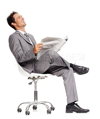 Buy stock photo Business man, laughing and reading newspaper in studio, headlines and information on current events. Businessperson, happy and knowledge or announcement on paper, news and update by white background