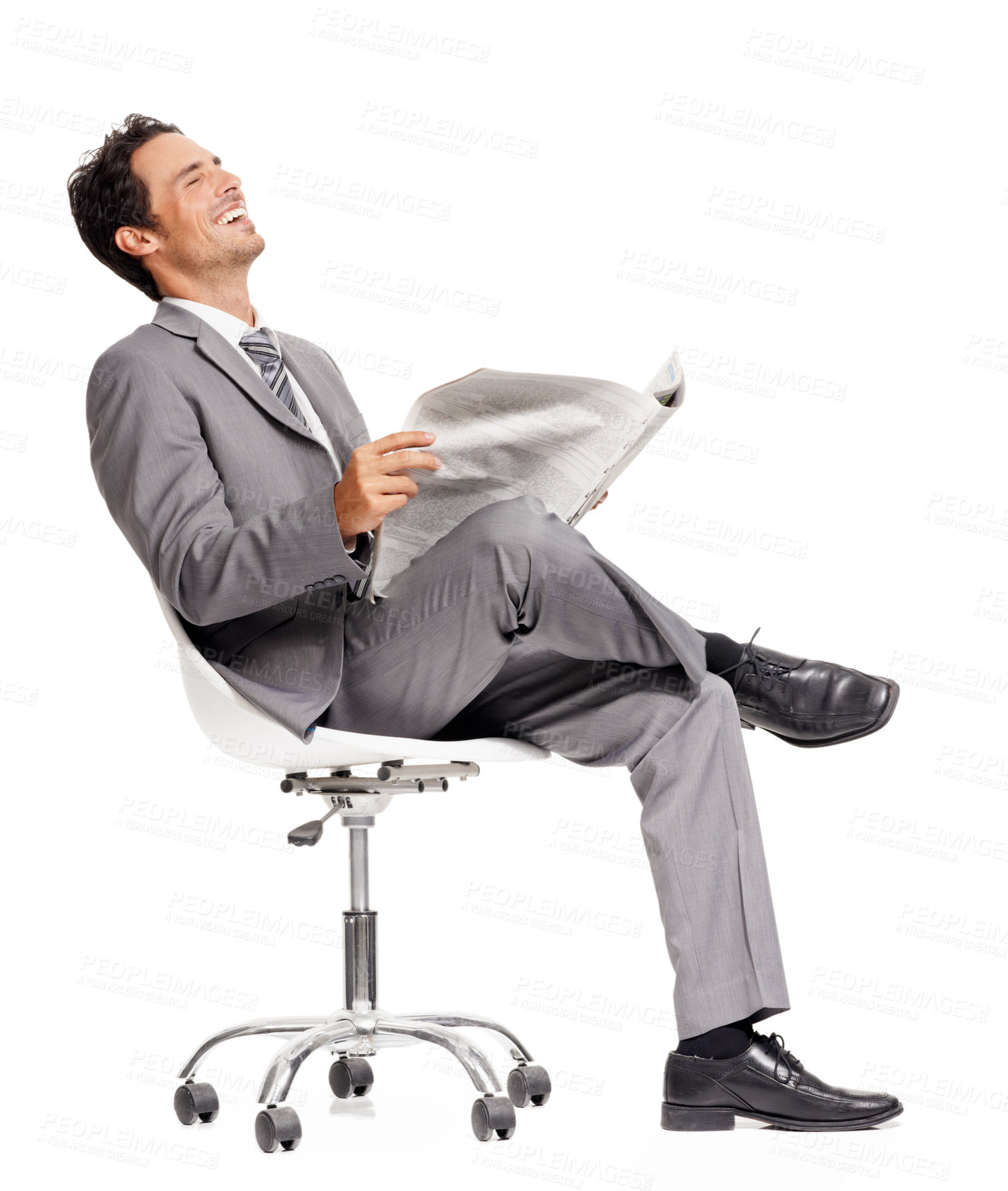 Buy stock photo Business man, laughing and reading newspaper in studio, headlines and information on current events. Businessperson, happy and knowledge or announcement on paper, news and update by white background