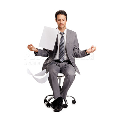 Buy stock photo A zen businessman sitting in the lotus position amidst a swarm of paperwork