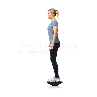 Buy stock photo Balance board, fitness and woman with training, wellness and girl isolated on a white studio background. Profile, person and model with equipment, mockup space and healthy with exercise and workout