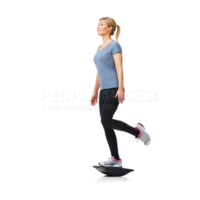 Buy stock photo Fitness, board and balance exercise with a woman in studio isolated on a white background for core. Gym, workout or training and young person standing on one leg with equipment for health or wellness