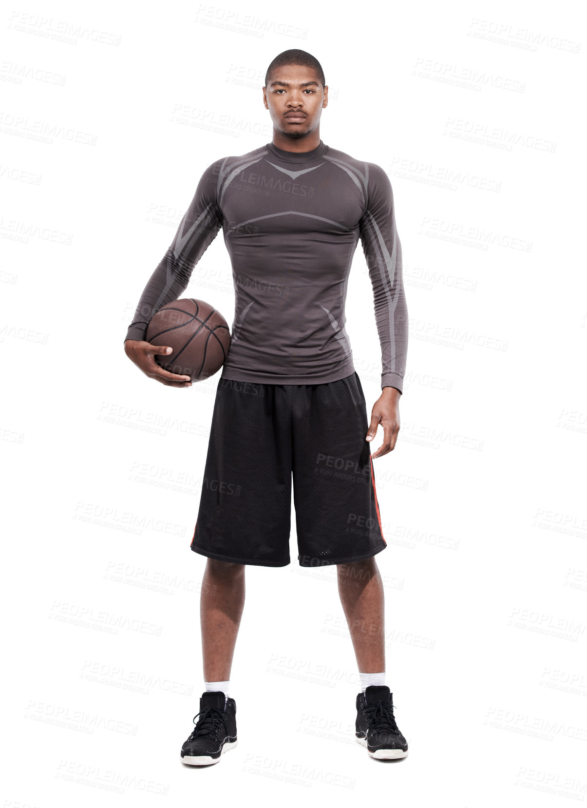 Buy stock photo Portrait of a handsome young basketball player standing in the studio