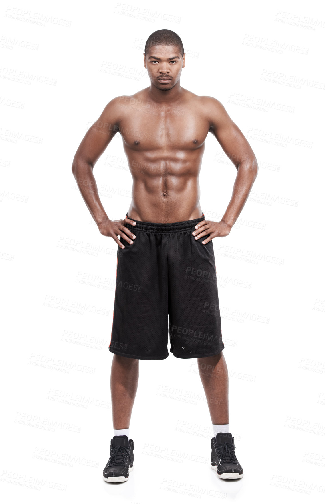 Buy stock photo Portrait of a handsome young man standing shirtless in the studio