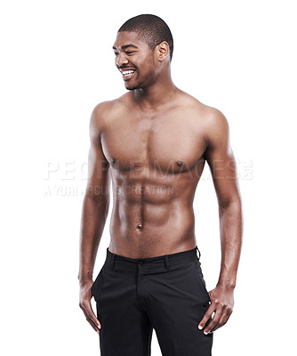 Buy stock photo A handsome young man standing shirtless in the studio