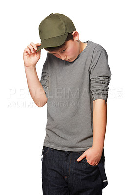 Buy stock photo Fashion, cool and a shy teenager with a cap isolated on a white background in a studio. Serious, thinking and a young boy looking awkward, introverted and with shame while stylish in clothes