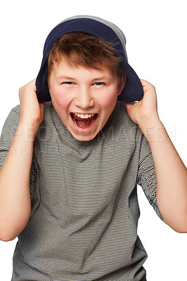 Buy stock photo A teenage boy pulling his beanie over his ears while screaming