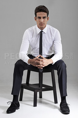 Buy stock photo Shirt, tie and portrait of businessman with chair in studio, grey background and mock up space. Confident, man and entrepreneur sitting on stool with commitment, pride and attention in backdrop 